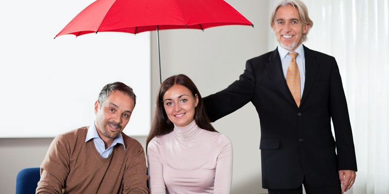 Agent providing insurance cover to a young couple